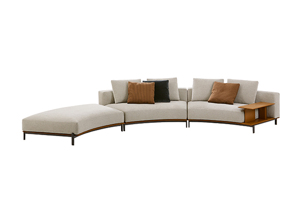 Light-colored sectional sofa with graceful curve silhouette